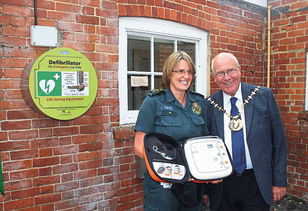 Nic Morecroft (left), lead responder manager for South Central Ambulance Service, and the Mayor of Basingstoke Roger Gardiner